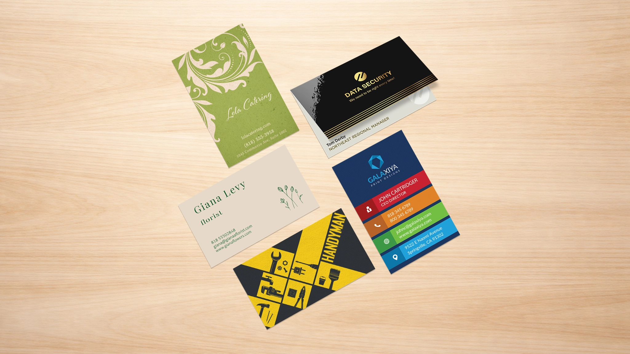 Graphic design for print marketing materials including business cards on wooden background
