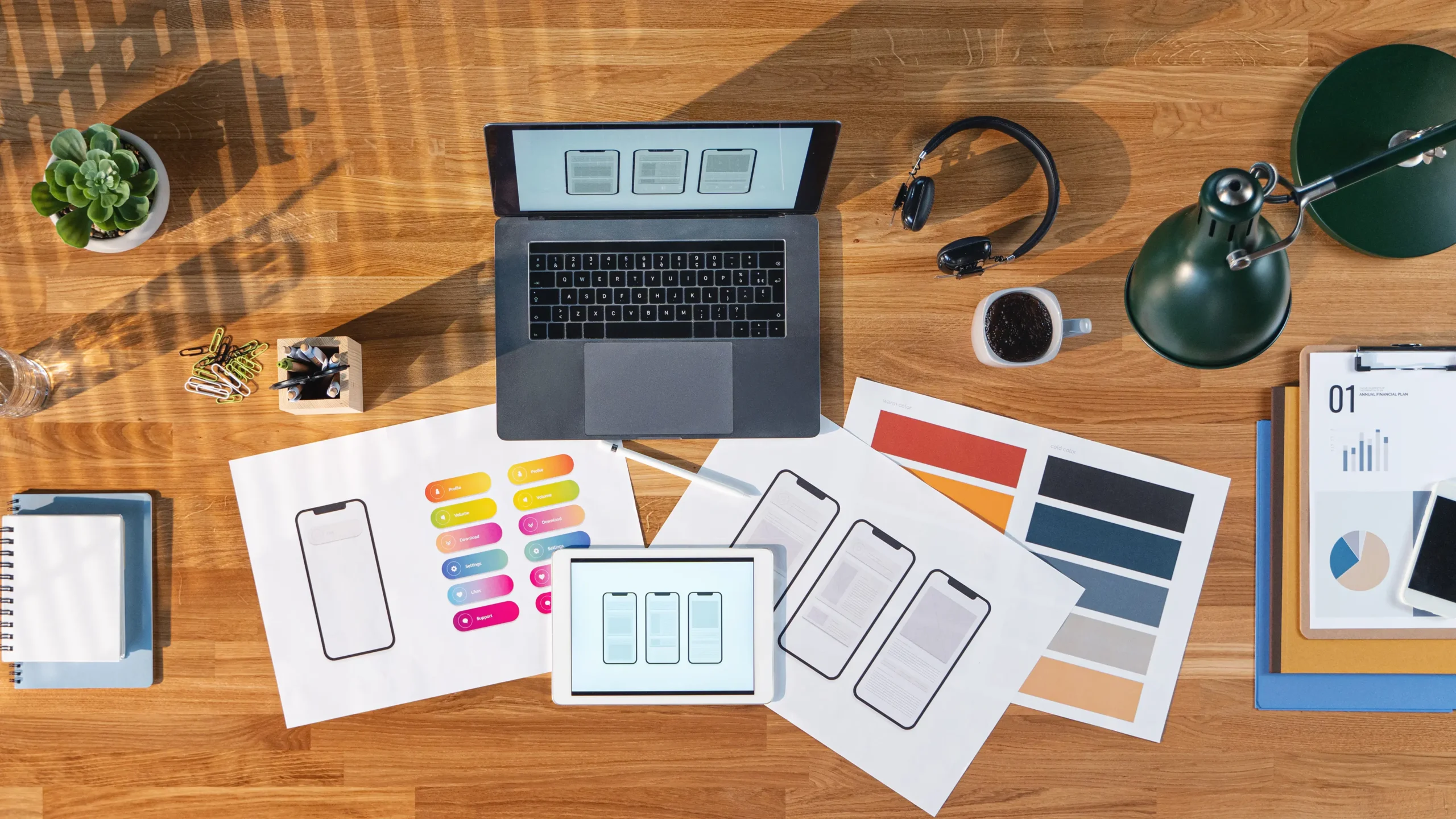 Website design workspace with laptop, tablet, and UI mockups for building modern business websites